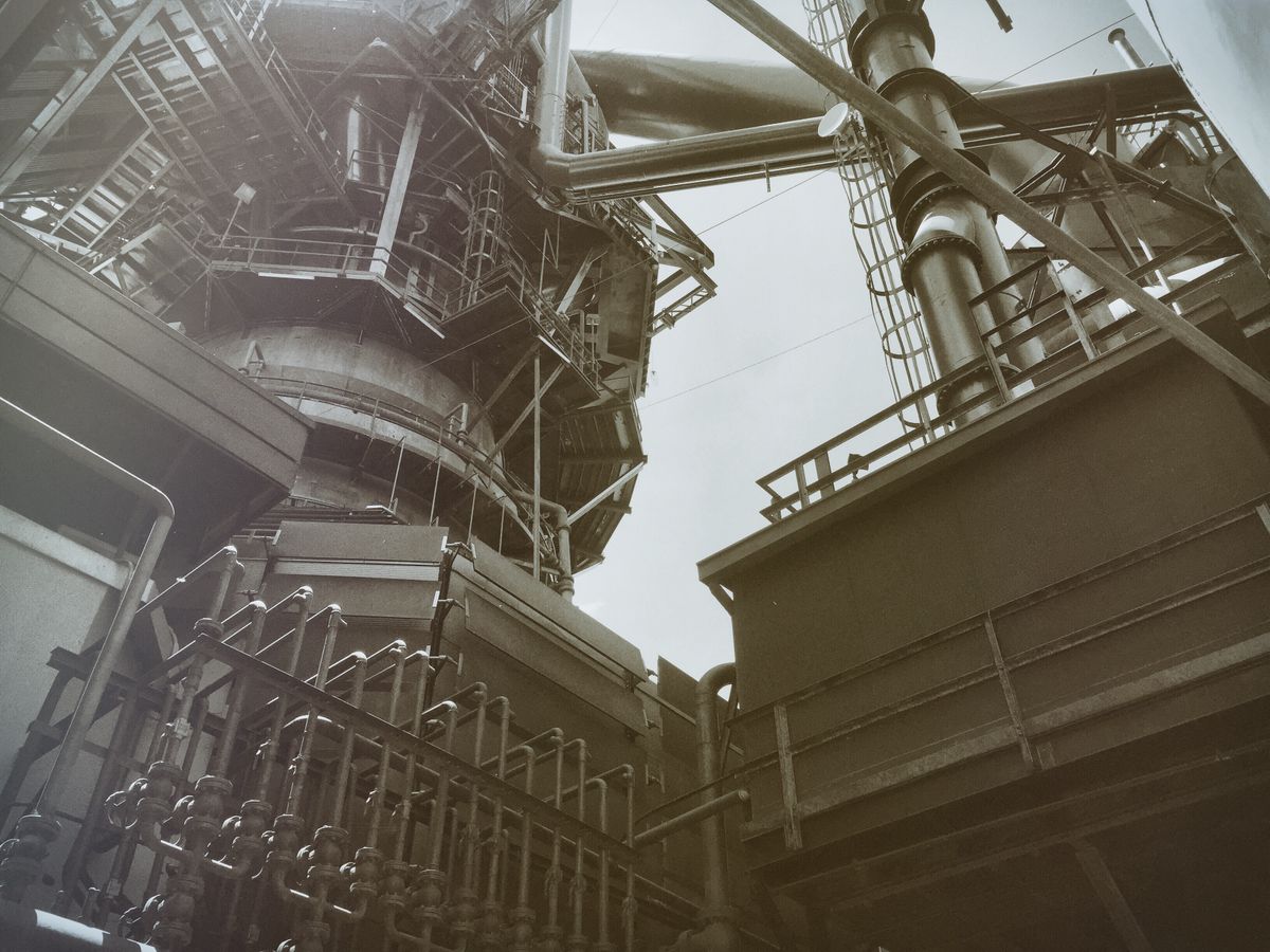 Low angle view of a process plant's structural steelwork and pipework